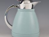 a tea pot with a teapot in it on a table