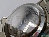 a close up of a watch on a metal bracelet