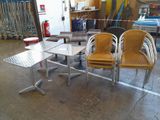 several chairs and a table in a room with a surfboard rack