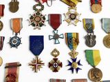 a lot of medals that are on display on the wall