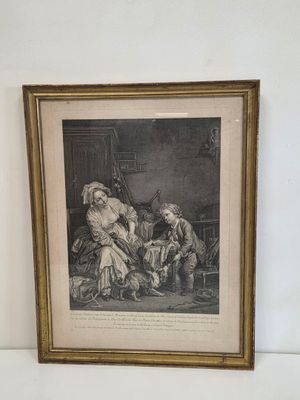 une vieille photo représentant un homme et une femme assis dans une pièce