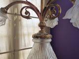 a lamp that is sitting on a table in front of a window