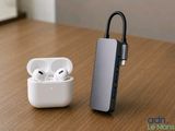 an apple airpods are sitting on a table next to a charger