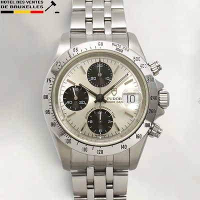 an image of a close up of a watch on a white surface
