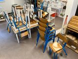 a room with many chairs and a table in it