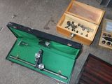 a suitcase that is sitting on the ground next to other items