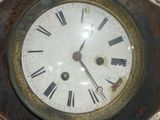 a clock with roman numerals on the face of it