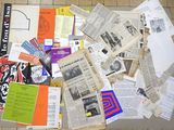 a pile of newspapers and other papers on the floor