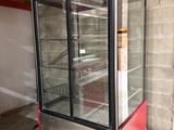 an image of a refrigerator with a glass door in a building