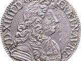 a close up of a coin with an image of a man on it
