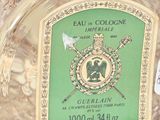a glass jar with a label on it that says guerlain
