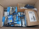 a cardboard box full of electronic gadgets in it