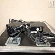 an image of a remote control and other electronics on top of a table