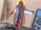 a box of electrical equipment on the ground next to a box of wires