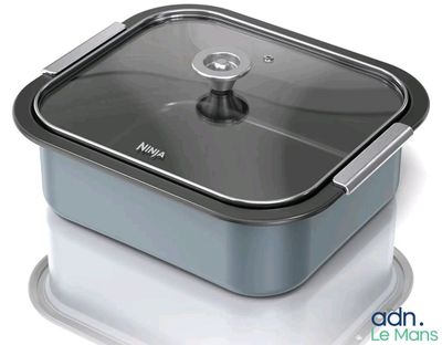 a metal container with a lid on a white surface