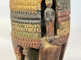 a vase that has a picture of a man inside of it
