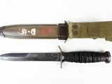 two knives that are sitting next to each other on a table
