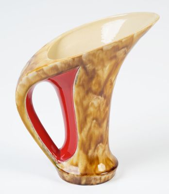 a vase with a red handle on a white background