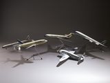 quatre modèles réduits d'avions qui volent dans les airs