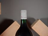 a bottle of wine that is sitting on a table