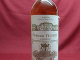 an image of a bottle of wine sitting on top of a table