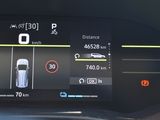 the dashboard of a car with a digital display showing the speed of a car