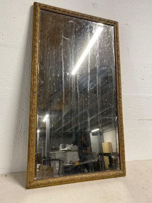 an image of a mirror sitting on top of a white wall