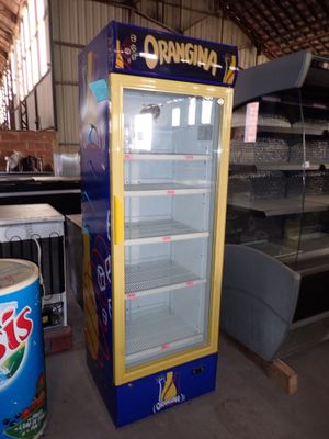 a display case that has drinks in it in a warehouse