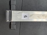 a metal door handle with a sticker on it