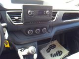a picture of a car dashboard with a radio and a steering wheel