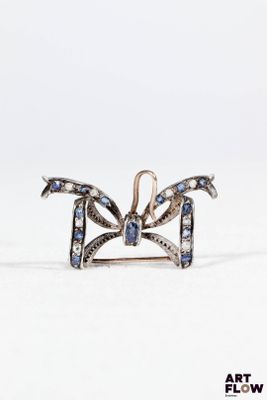 Broche nœud en argent 800 millièmes et or 18 k (750/1000) or…