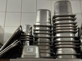 many pots and pans stacked on top of each other