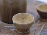 a small bowl and two small bowls on a table