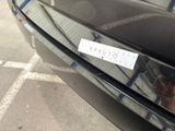a sticker on the hood of a black car