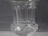 a glass vase that is sitting on a table