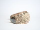 a close up of a ring on a white surface