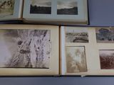 an open book with a bunch of old photos on top of it