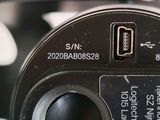 a close up of a digital camera with a button on it