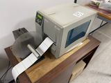 an image of a printer sitting on top of a wooden table