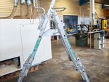 a ladder that is sitting in the middle of a room