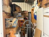 a small room with a lot of boxes and appliances