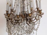 a chandelier hanging from the ceiling with many lights