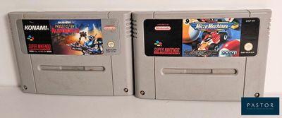 two nintendo game cartridges sitting next to each other on a table