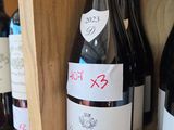 many bottles of wine on the shelves in the store