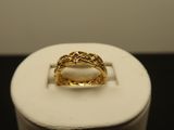 an image of a gold ring with a pink stone in it