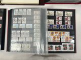 a lot of stamps on a table with a book