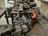 a machine that is sitting on a table in a garage