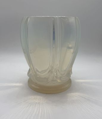 a clear glass vase with a wavy design on it