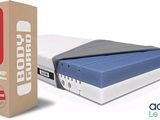 bed in a box with a box of bedding next to it