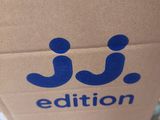 a brown paper bag with a blue logo on it